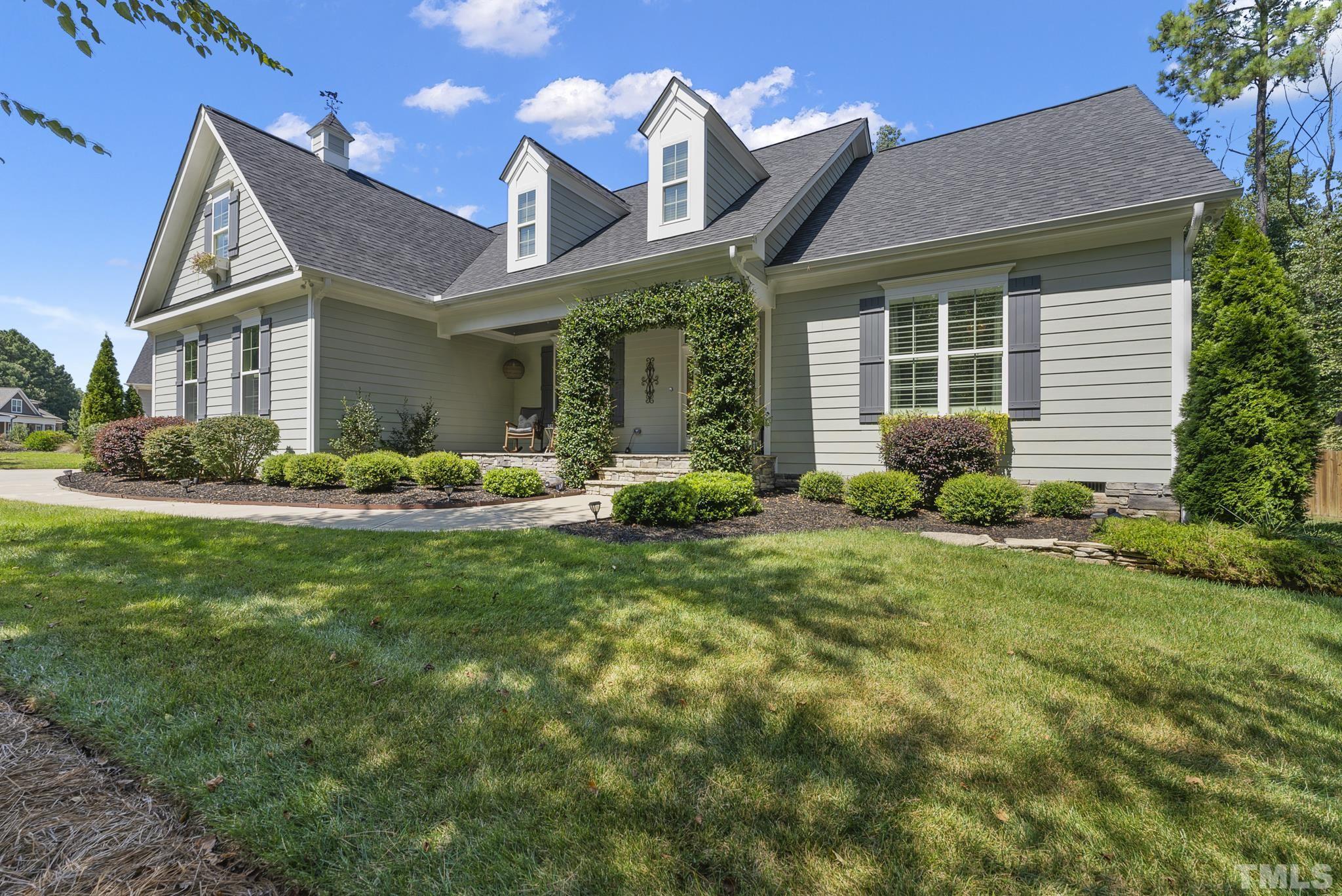 6121 Spring Branch Circle Raleigh, NC 27603 - Photo 3 of 60 a front view of a house with garden and plants
