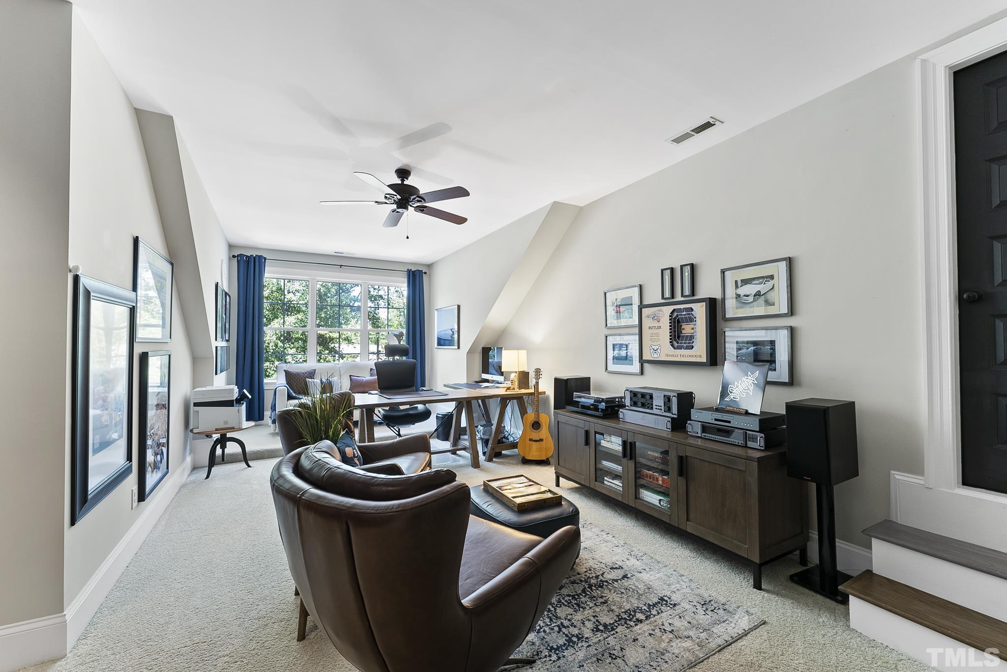 6121 Spring Branch Circle Raleigh, NC 27603 - Photo 32 of 60 a living room with furniture and a large window