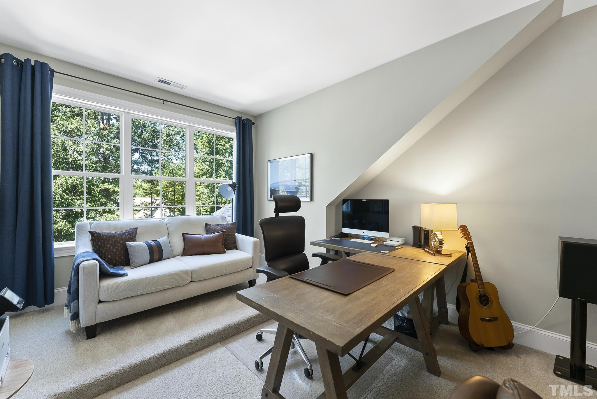 6121 Spring Branch Circle Raleigh, NC 27603 - Photo 34 of 60 a living room with furniture and a flat screen tv