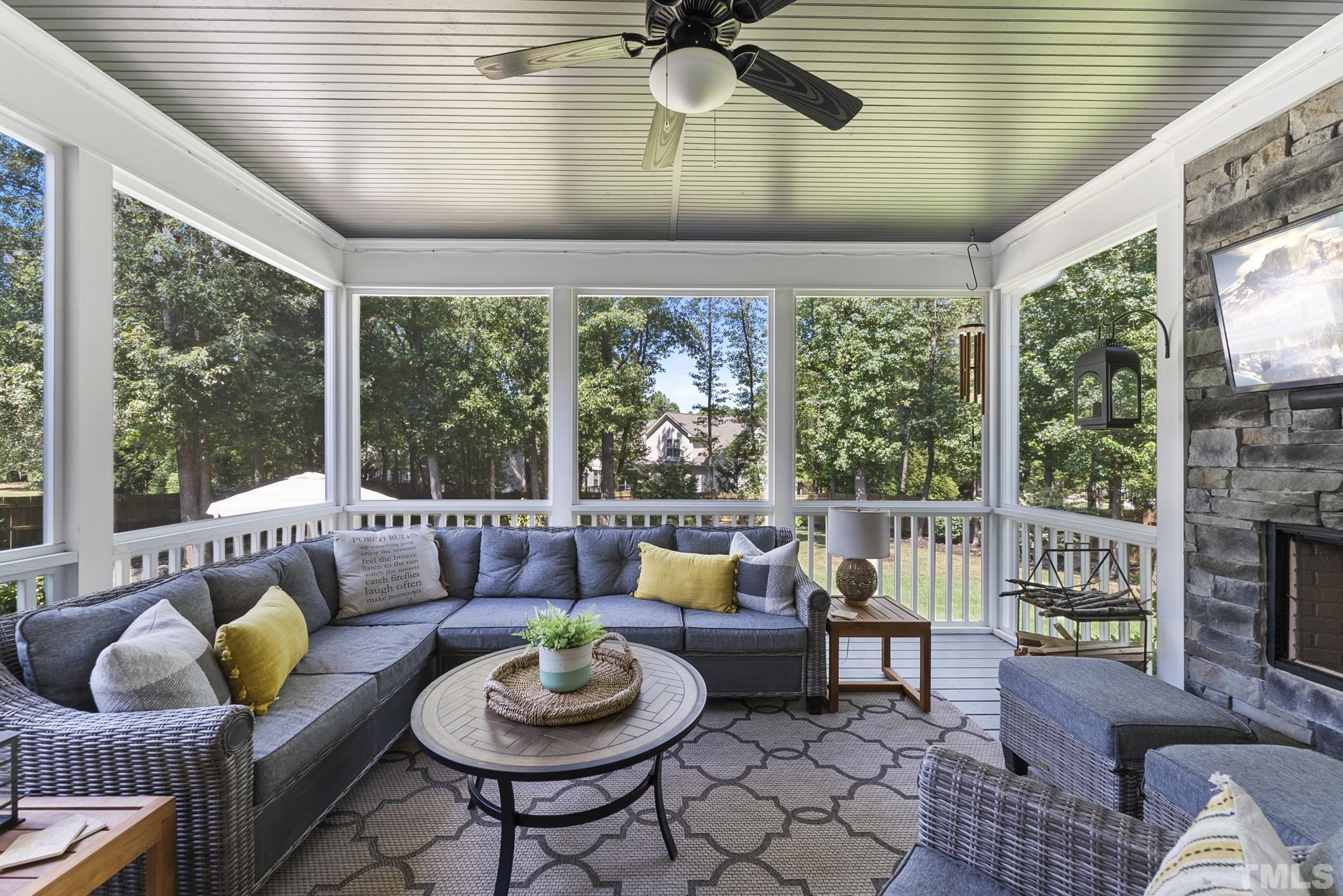 6121 Spring Branch Circle Raleigh, NC 27603 - Photo 40 of 60 a living room with furniture and a floor to ceiling window