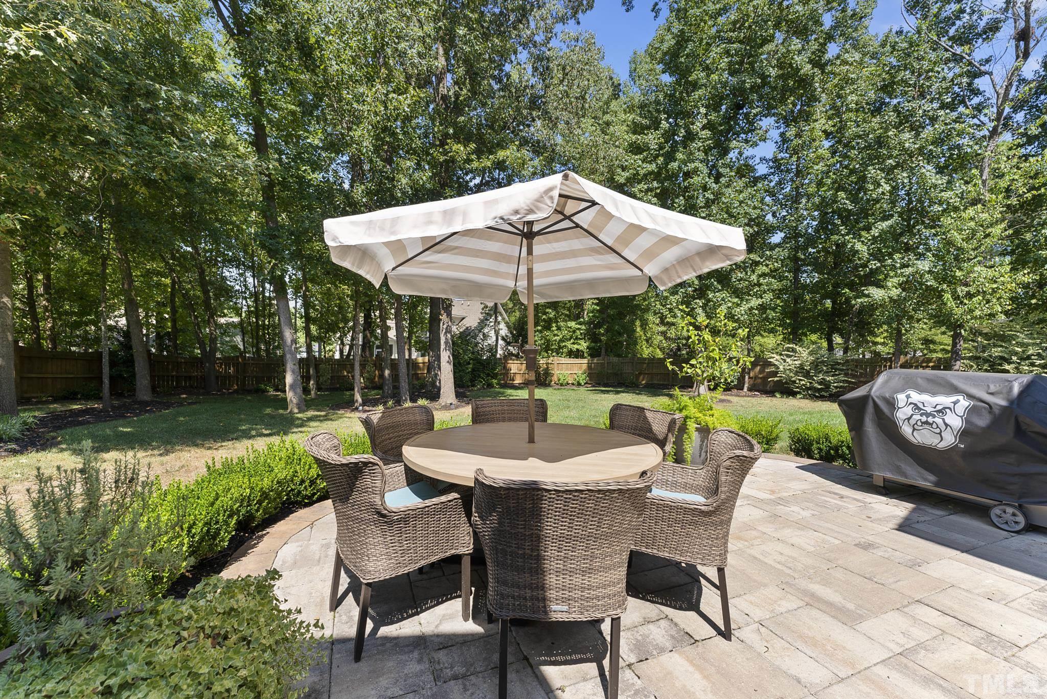 6121 Spring Branch Circle Raleigh, NC 27603 - Photo 45 of 60 a view of a patio with furniture and a yard