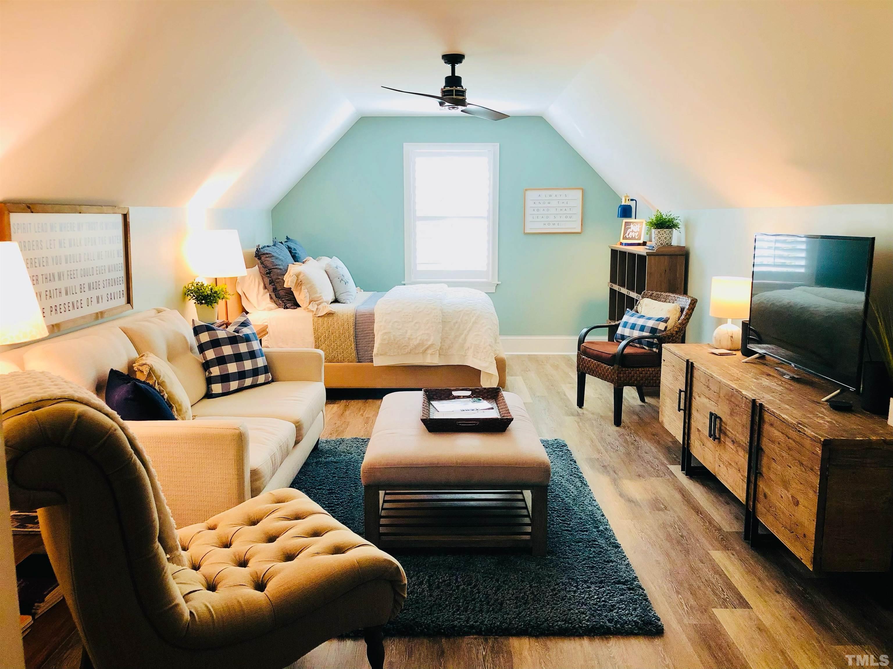 6121 Spring Branch Circle Raleigh, NC 27603 - Photo 58 of 60 a living room with furniture and a flat screen tv
