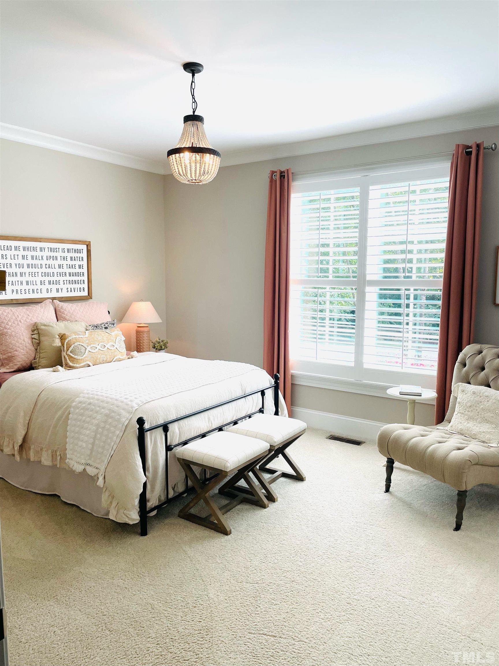 6121 Spring Branch Circle Raleigh, NC 27603 - Photo 60 of 60 a spacious bedroom with a bed and a couch