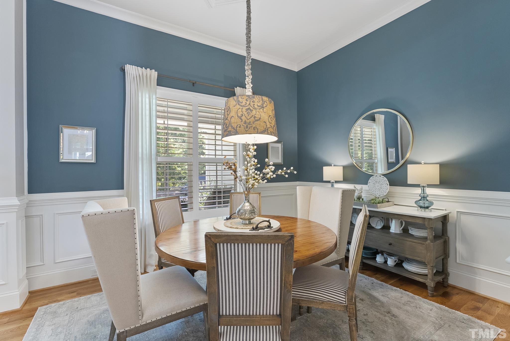 6121 Spring Branch Circle Raleigh, NC 27603 - Photo 6 of 60 a dining room with furniture a window and a chandelier