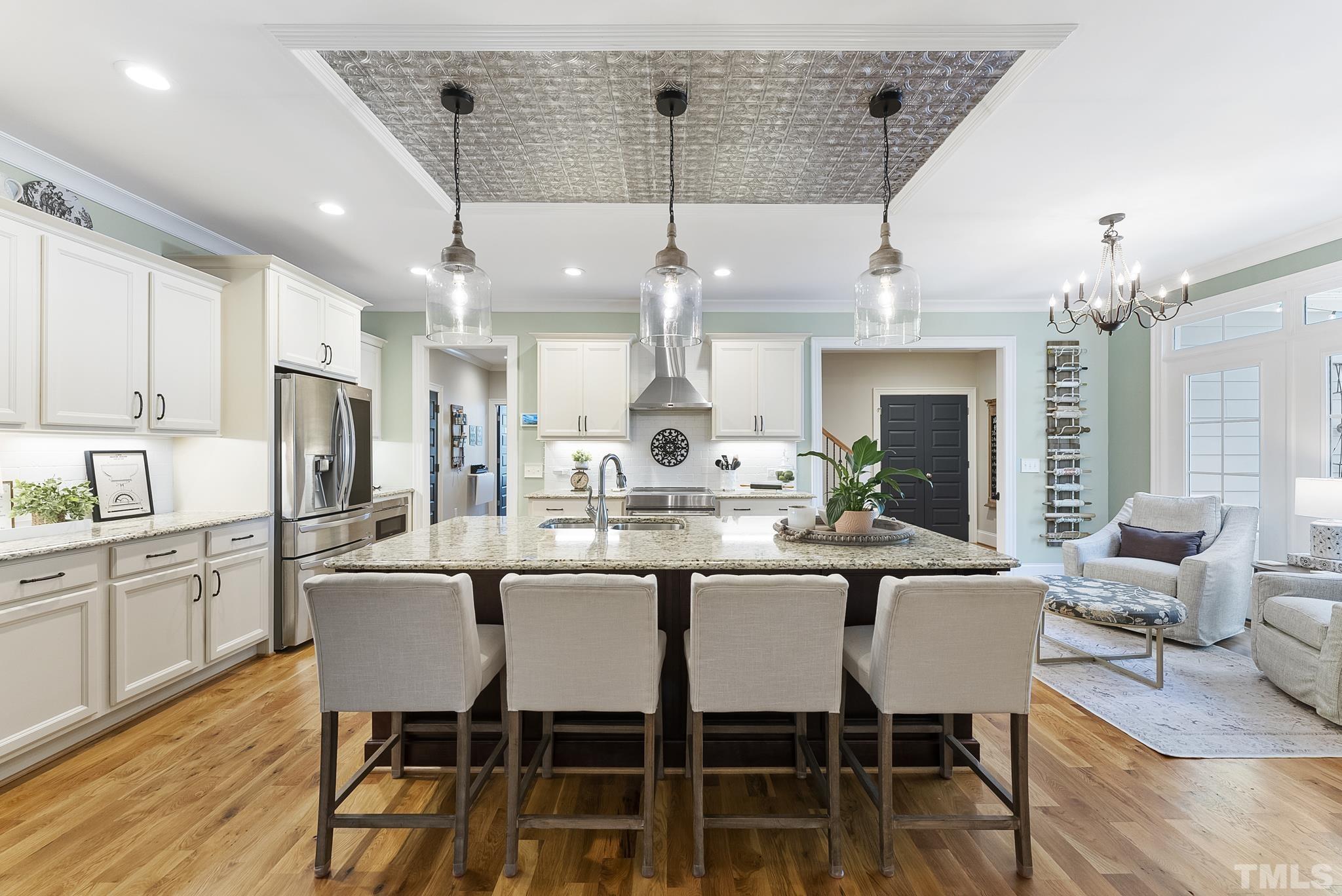 6121 Spring Branch Circle Raleigh, NC 27603 - Photo 10 of 60 a view of a dining room with furniture window and wooden floor