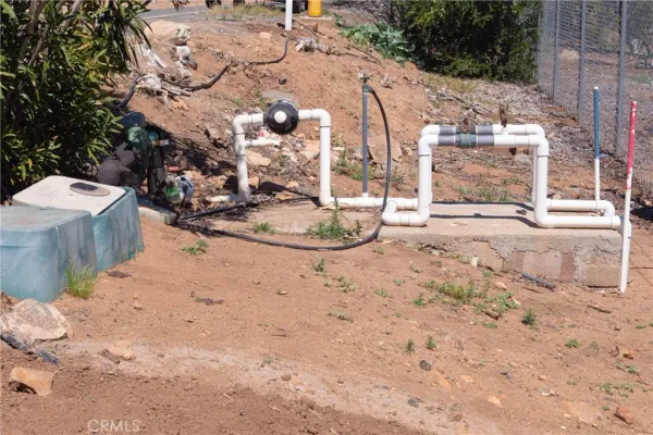 a view of a park with iron fence