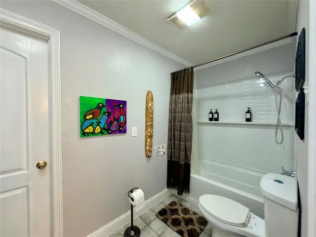 a bathroom with a granite countertop sink toilet a mirror a vanity and shower
