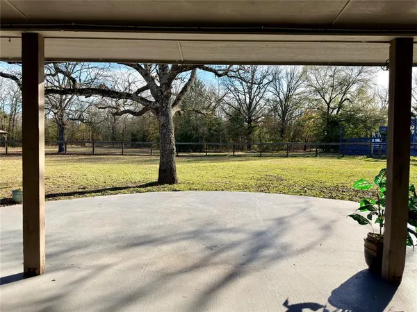 a view of a garden with a swimming pool