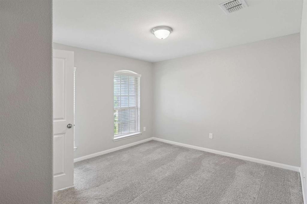112 Garner Court Forney, TX 75126 - Photo 14 of 15 an empty room with windows