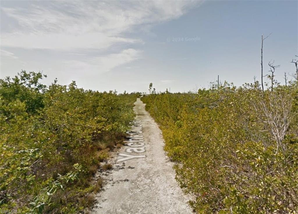 10 5th Avenue Big Pine Key, FL 33043 - Photo 3 of 6 a view of a pathway with a yard