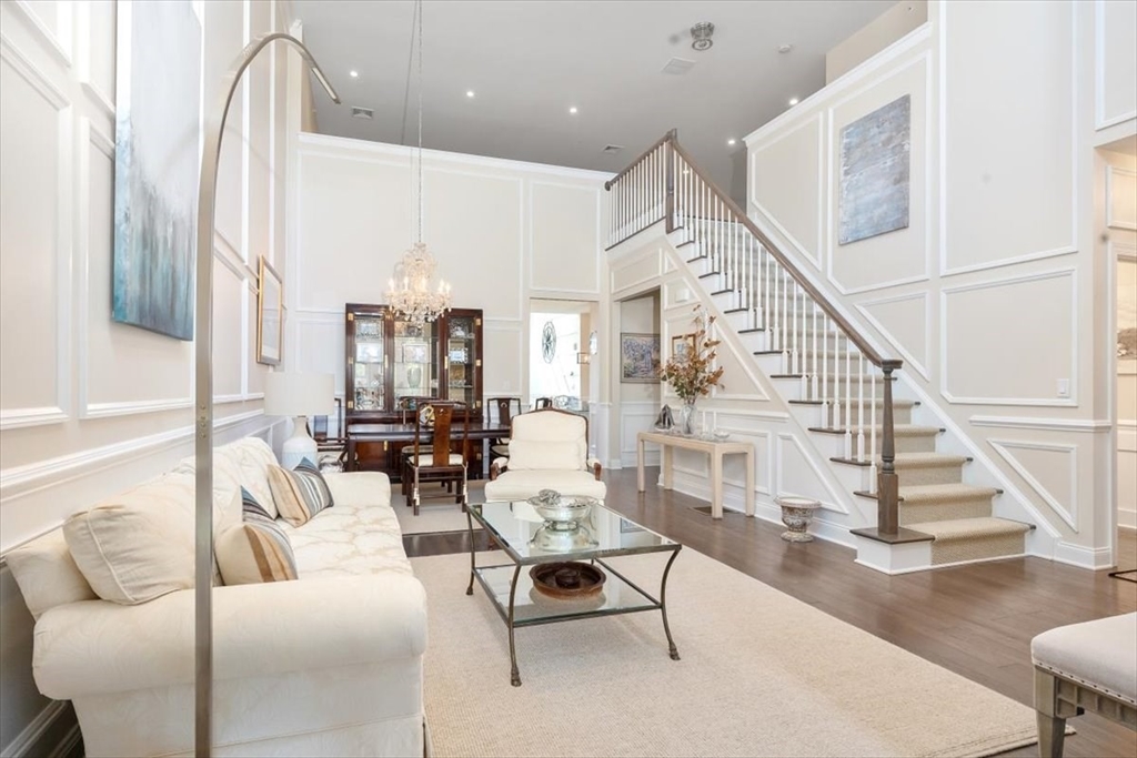 5 Brand Boulevard, Unit 5 Scituate, MA 02066 - Photo 1 of 42 a living room with furniture and wooden floor