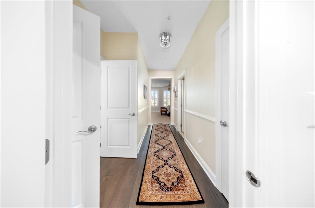 5 Brand Boulevard, Unit 5 Scituate, MA 02066 - Photo 16 of 42 a view of hallway with wooden floor