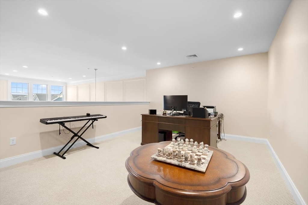 5 Brand Boulevard, Unit 5 Scituate, MA 02066 - Photo 21 of 42 a room with furniture and a table