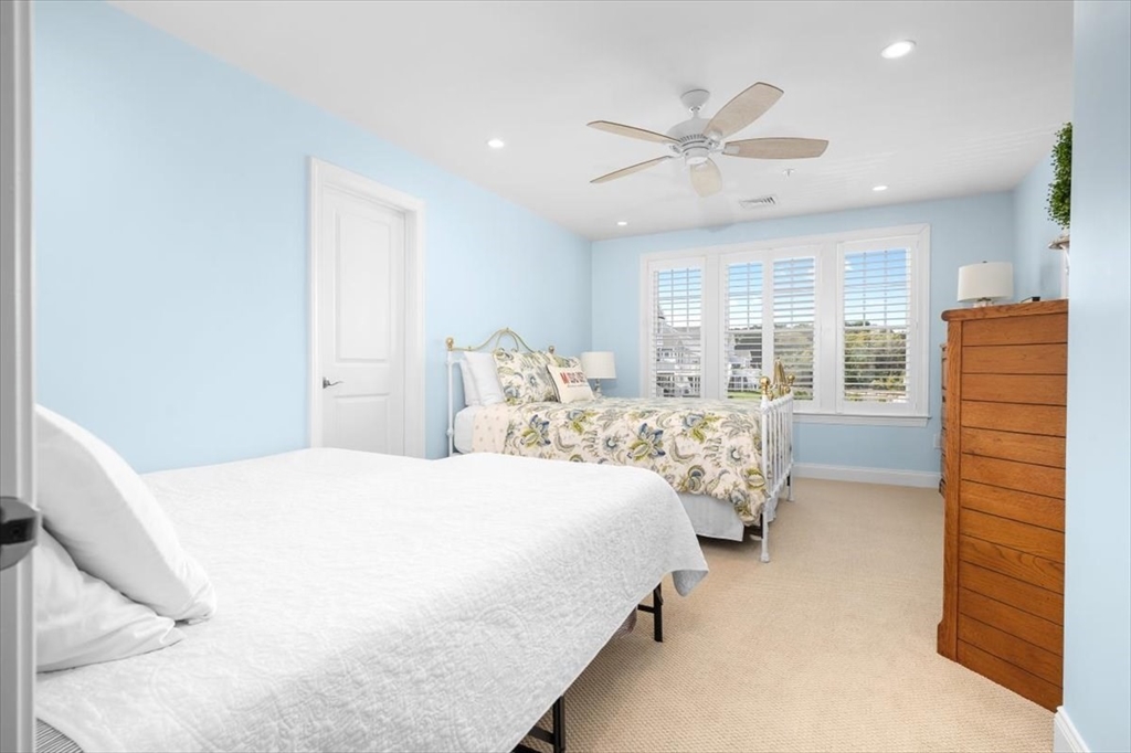 5 Brand Boulevard, Unit 5 Scituate, MA 02066 - Photo 24 of 42 a bedroom with a bed and window