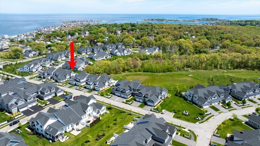 5 Brand Boulevard, Unit 5 Scituate, MA 02066 - Photo 32 of 42 an aerial view of a houses with a lake view