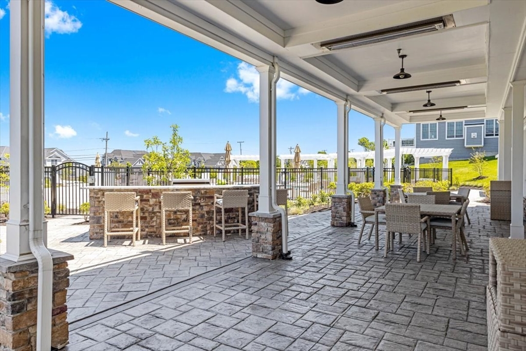5 Brand Boulevard, Unit 5 Scituate, MA 02066 - Photo 34 of 42 a outdoor space with lots of tables a garden and chairs