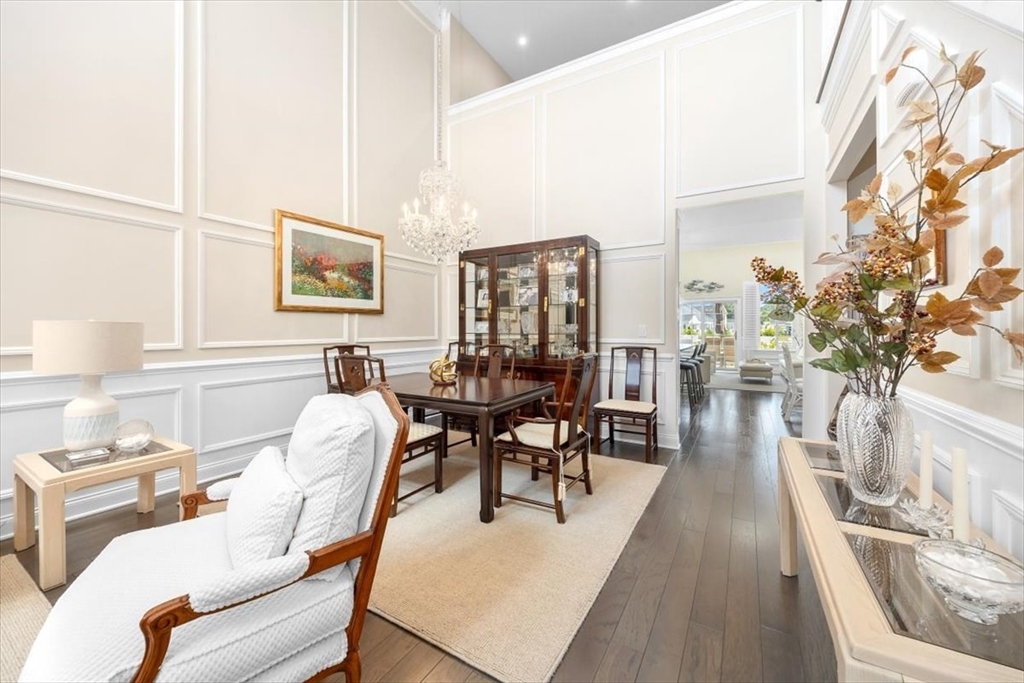 5 Brand Boulevard, Unit 5 Scituate, MA 02066 - Photo 5 of 42 a living room with furniture a dining table and a potted plant