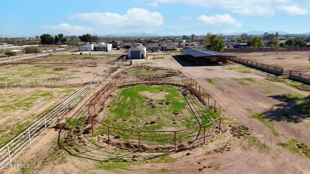 a view of a swimming pool with a yard