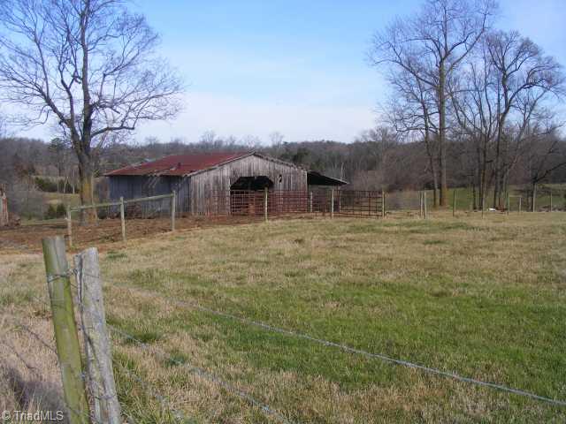 Exterior Front. Horse Barn and Pasture.
