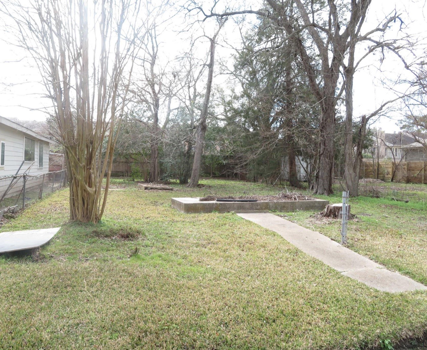 9221 Clarkcrest Street Houston, TX 77063 - Photo 2 of 3 a view of a backyard with large trees