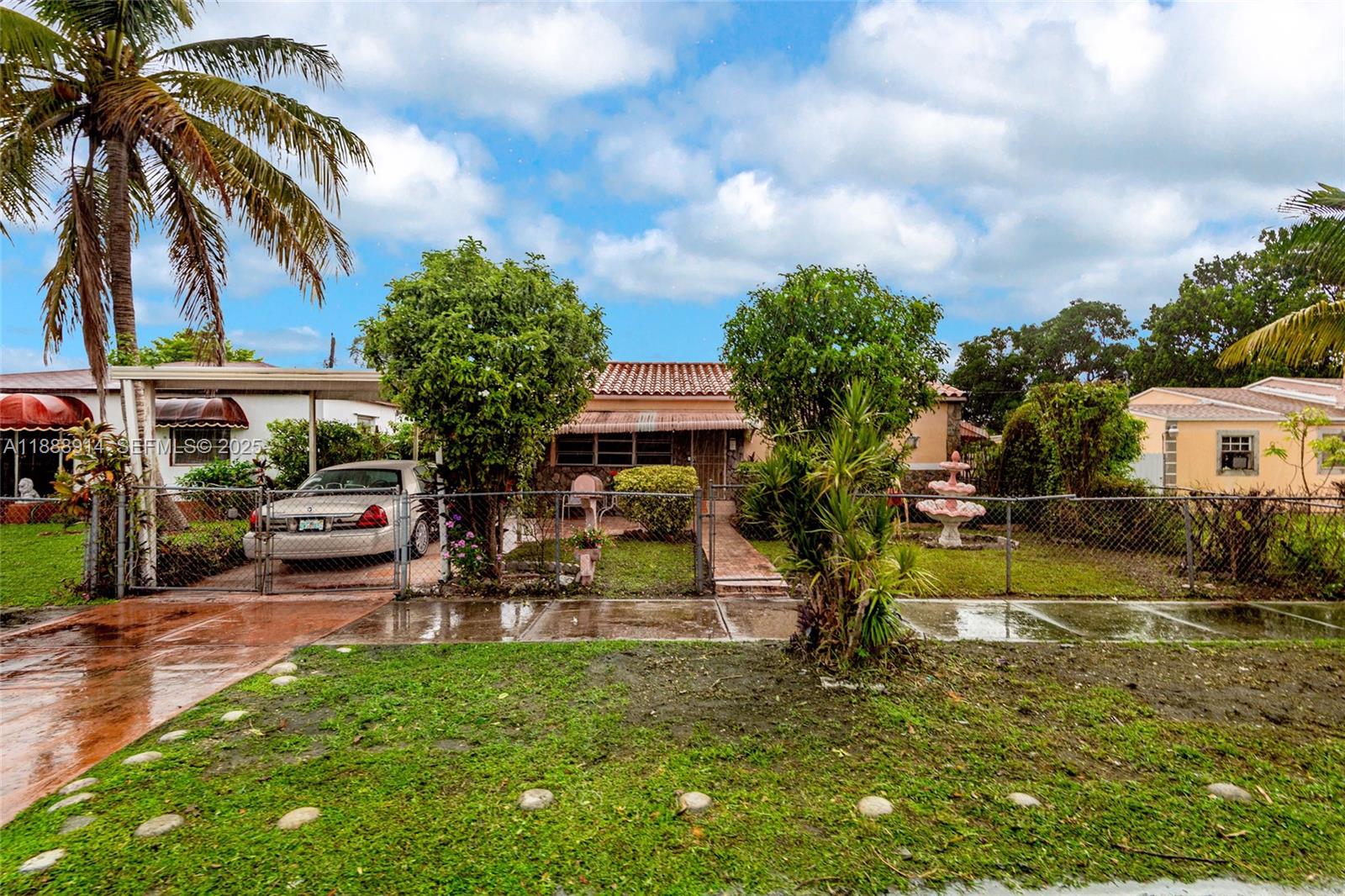 1083 Northwest 74th Street Miami, FL 33150 - Photo 1 of 28 a view of a house with swimming pool and sitting area