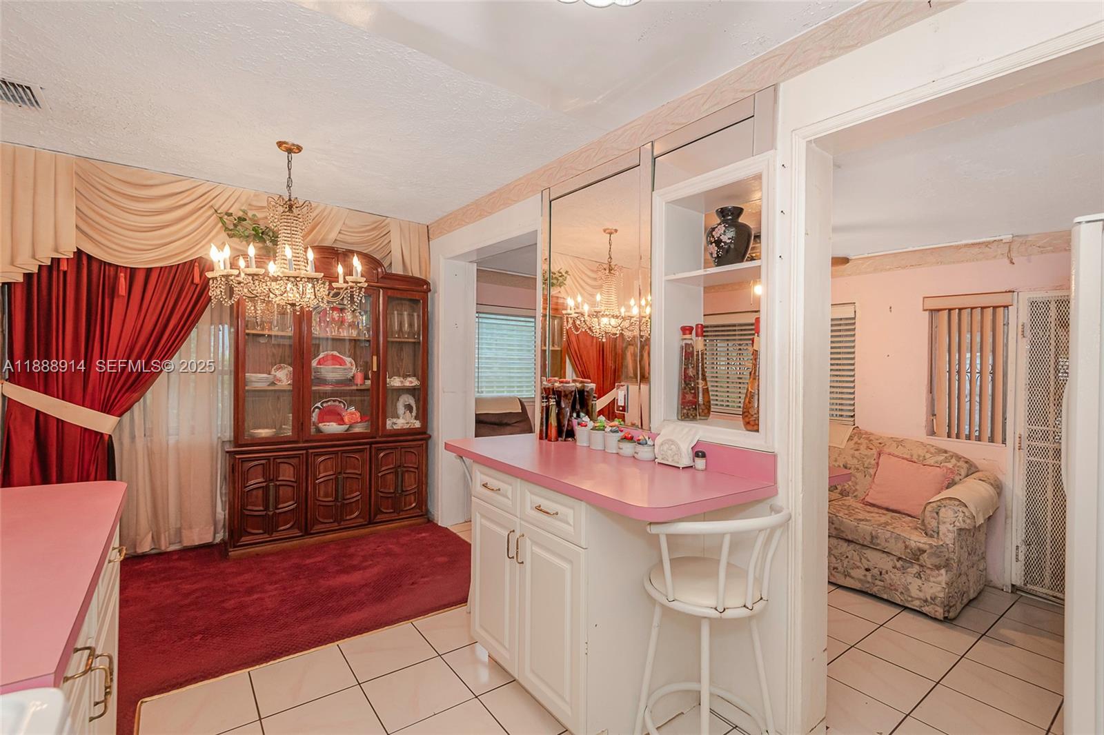 1083 Northwest 74th Street Miami, FL 33150 - Photo 12 of 28 a kitchen with a sink cabinets and window