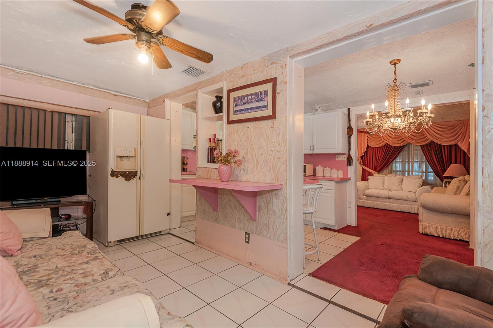 1083 Northwest 74th Street Miami, FL 33150 - Photo 15 of 28 a bedroom with furniture and a flat screen tv