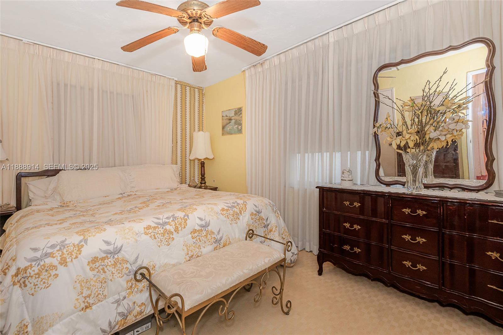 1083 Northwest 74th Street Miami, FL 33150 - Photo 17 of 28 a bedroom with a bed and a dresser