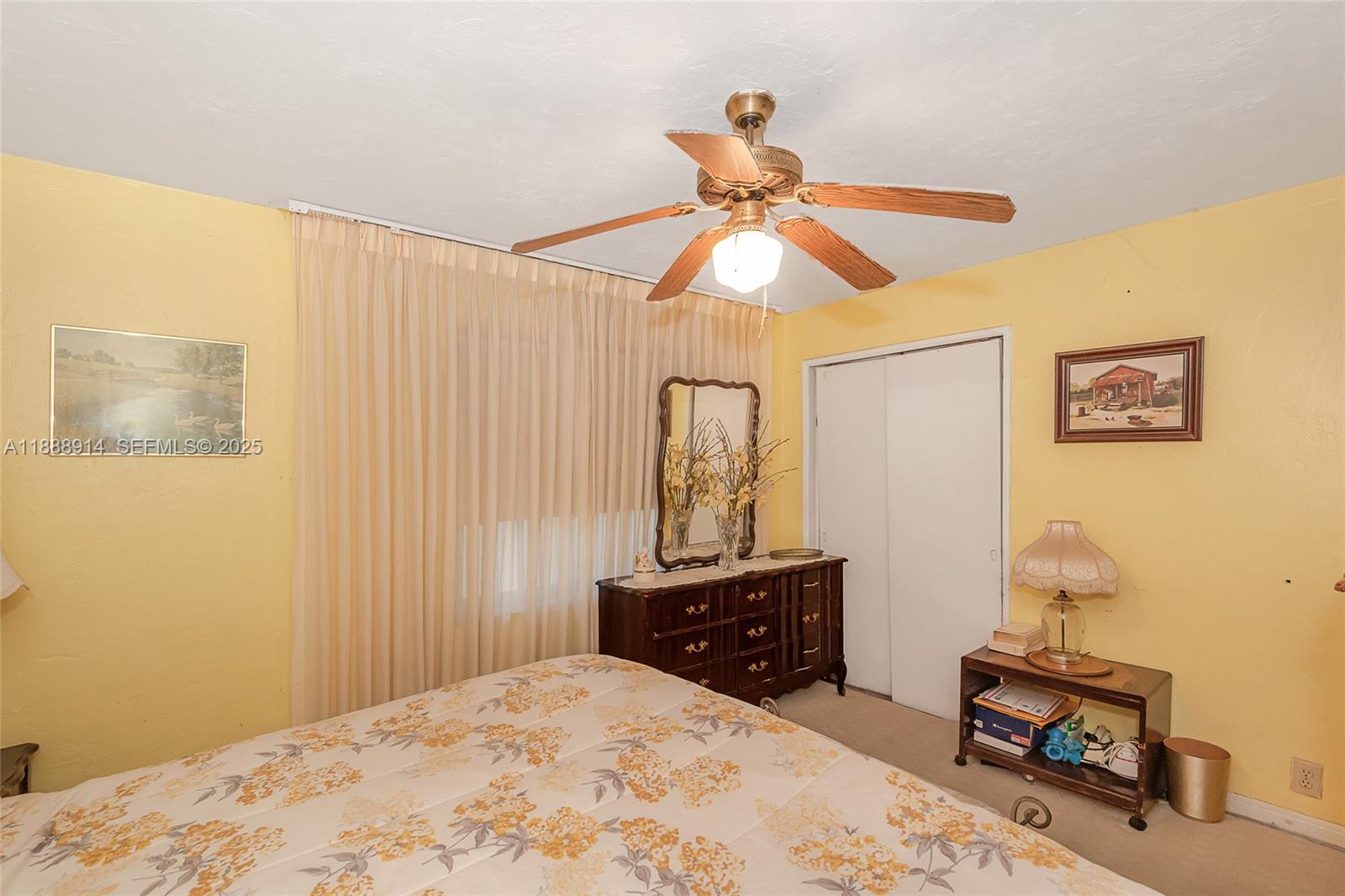 1083 Northwest 74th Street Miami, FL 33150 - Photo 18 of 28 a bedroom with a bed and a dresser
