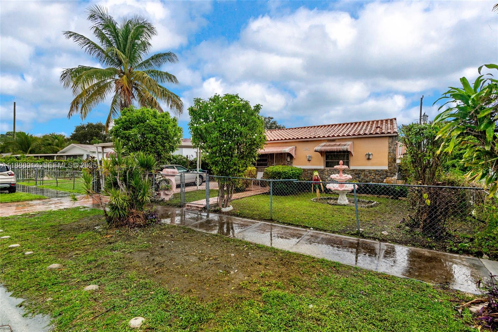 1083 Northwest 74th Street Miami, FL 33150 - Photo 2 of 28 a view of a house with a yard