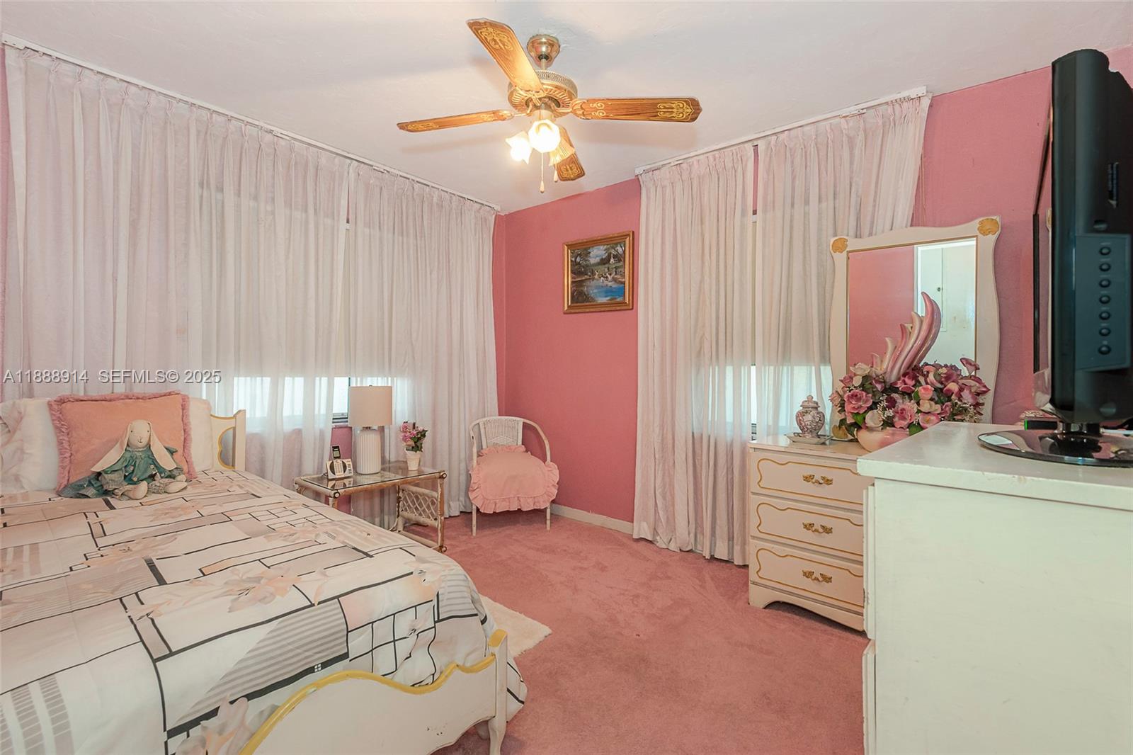 1083 Northwest 74th Street Miami, FL 33150 - Photo 21 of 28 a bedroom with a bed and a dresser