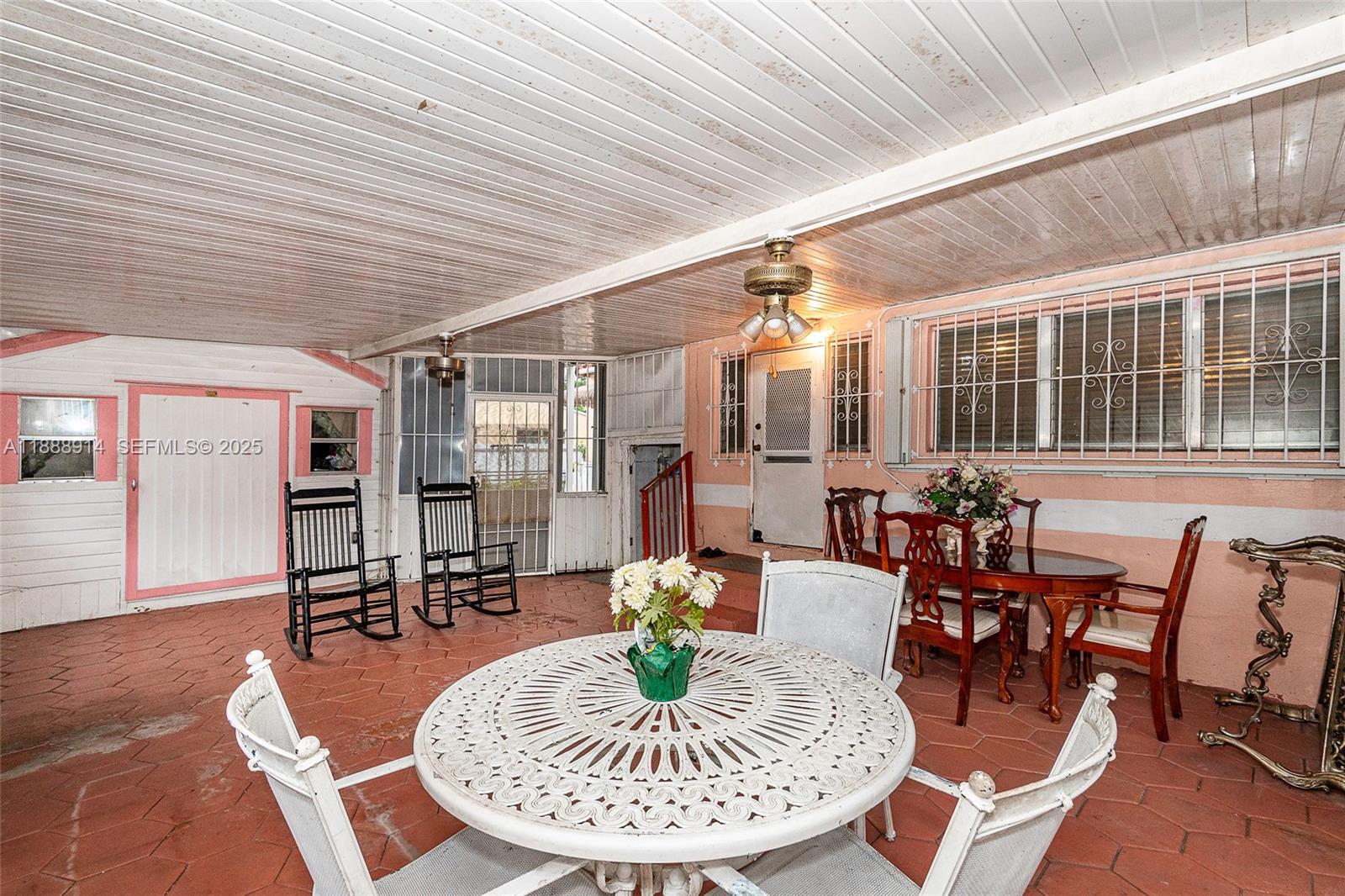 1083 Northwest 74th Street Miami, FL 33150 - Photo 26 of 28 a dining room with furniture wooden floor and a table