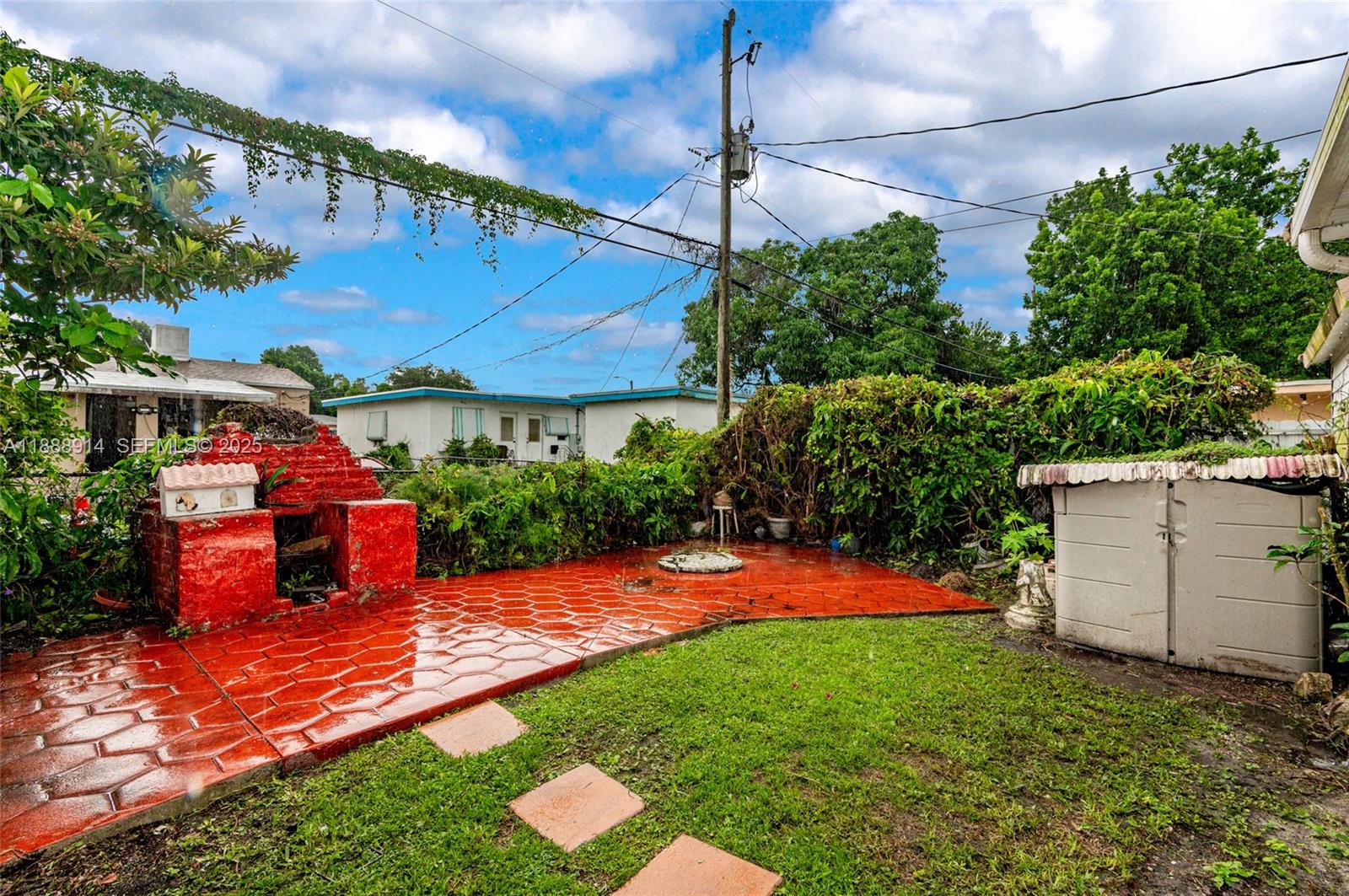 1083 Northwest 74th Street Miami, FL 33150 - Photo 27 of 28 a view of a backyard with potted plants