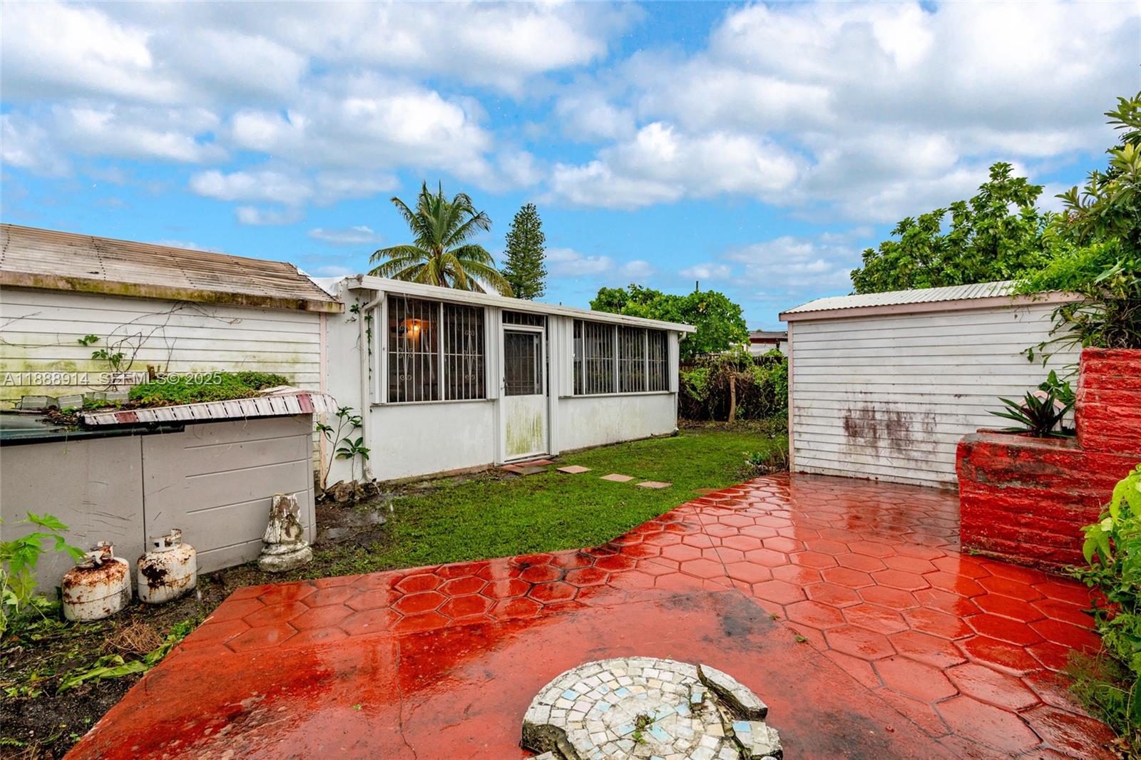 1083 Northwest 74th Street Miami, FL 33150 - Photo 28 of 28 a front view of a house with garden