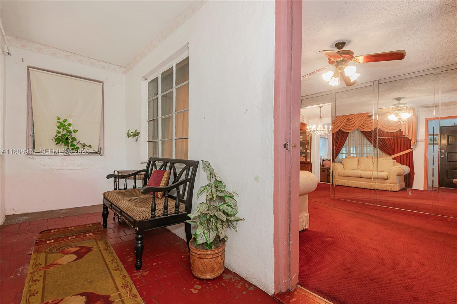 1083 Northwest 74th Street Miami, FL 33150 - Photo 3 of 28 a view of a livingroom with furniture and a potted plant