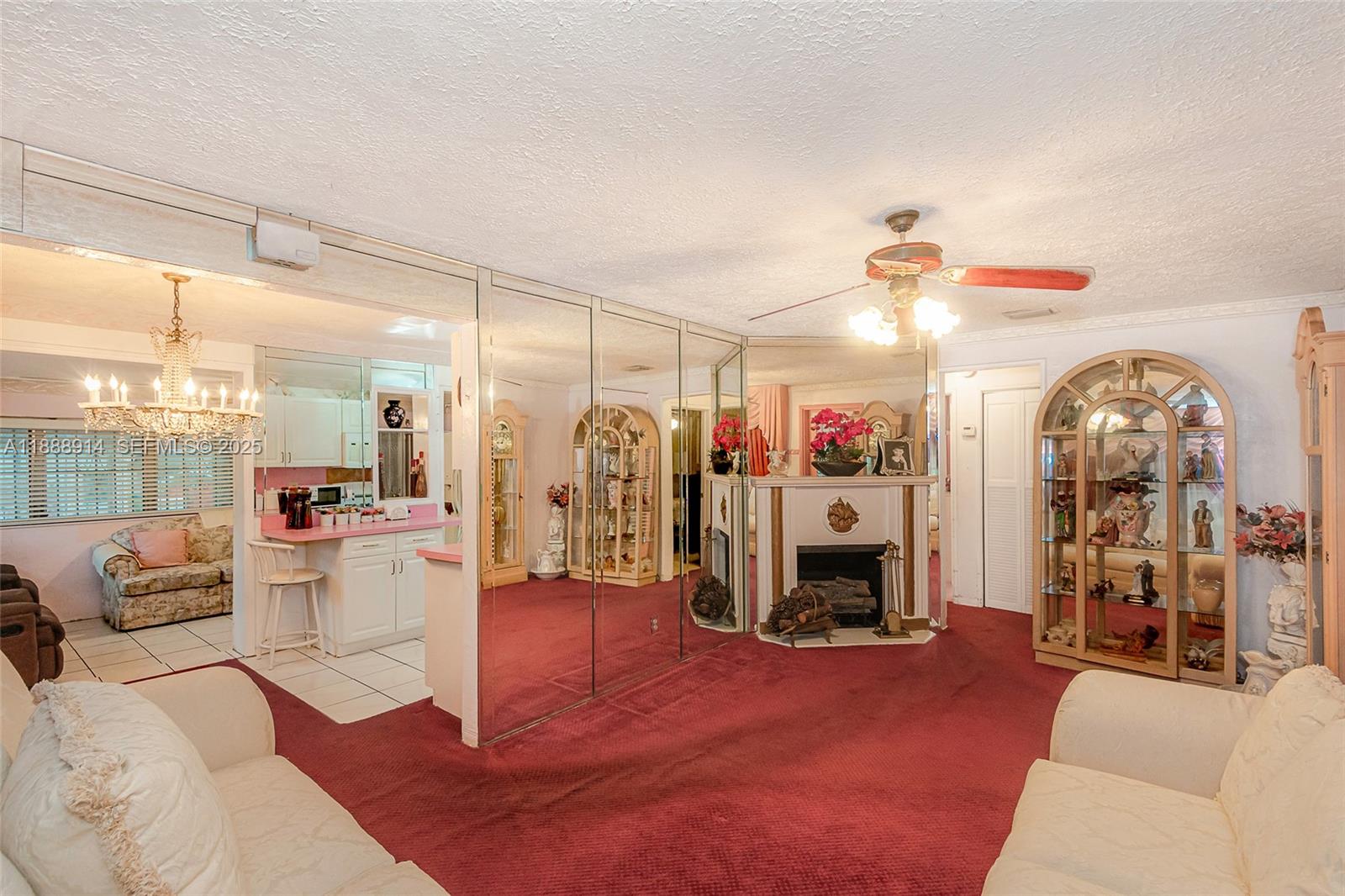 1083 Northwest 74th Street Miami, FL 33150 - Photo 5 of 28 a living room with furniture and a fireplace