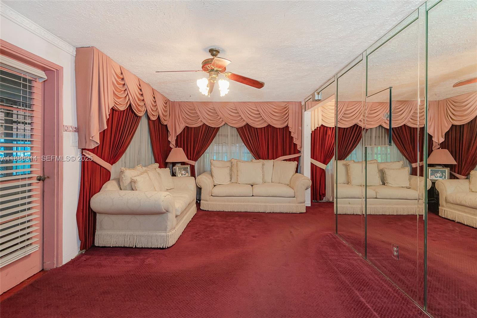 1083 Northwest 74th Street Miami, FL 33150 - Photo 7 of 28 a view of an empty room with wooden floor
