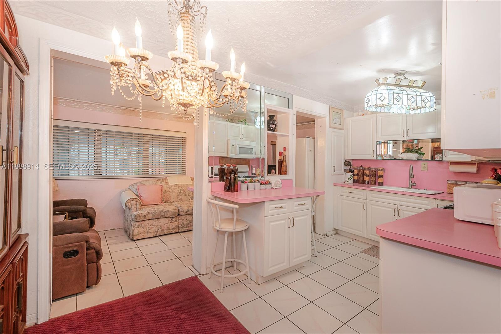 1083 Northwest 74th Street Miami, FL 33150 - Photo 8 of 28 a very nice looking room with a large window