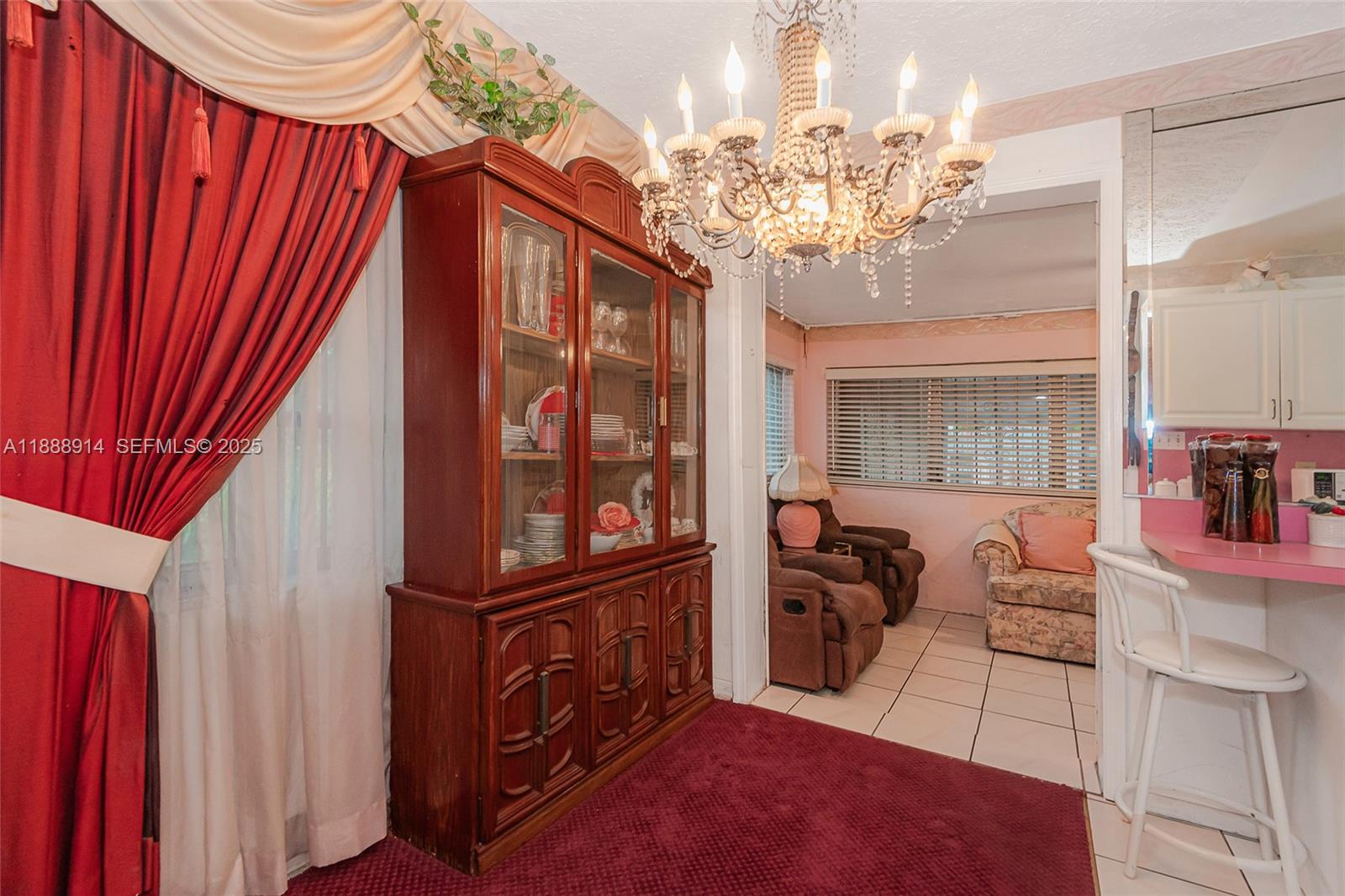 1083 Northwest 74th Street Miami, FL 33150 - Photo 10 of 28 a view of a dining room with furniture and chandelier