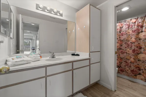 a bathroom with a double vanity sink and mirror