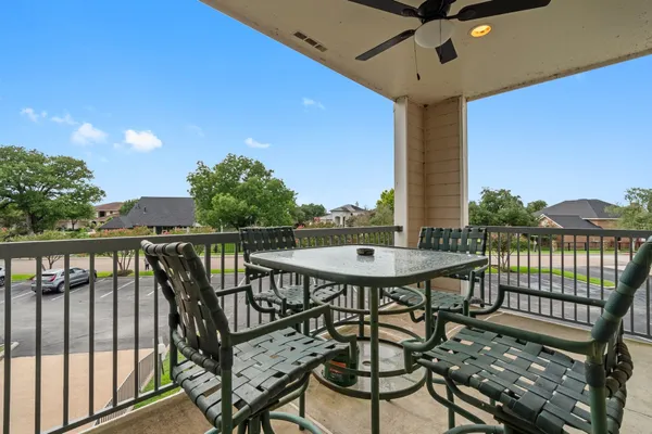 a view of a balcony with furniture