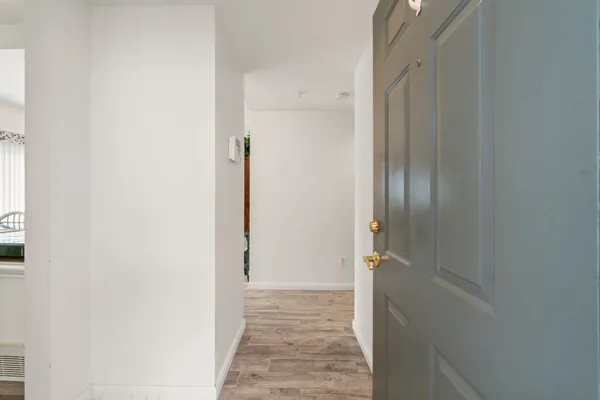 a view of a bathroom from a hallway