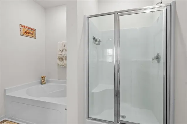 a bathroom with a shower and a sink