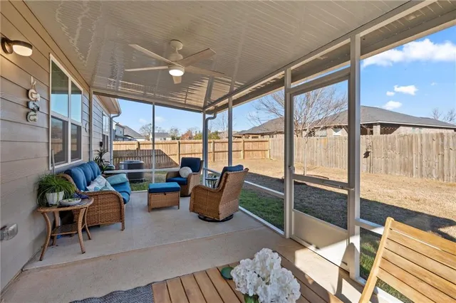 a outdoor living space with patio furniture and potted plants