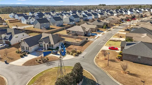 an aerial view of a house with swimming pool