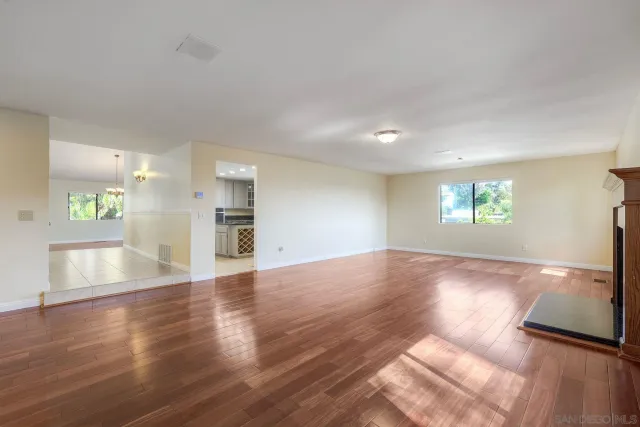 a kitchen with granite countertop a sink and a stove