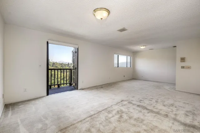 a bathroom with a granite countertop double vanity sink and a mirror