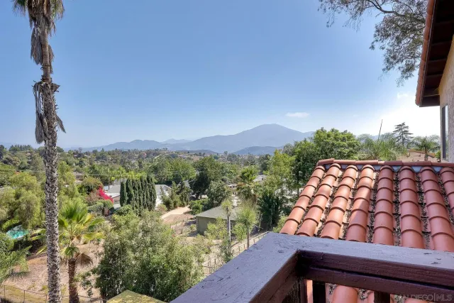 a view of a balcony with wooden floor
