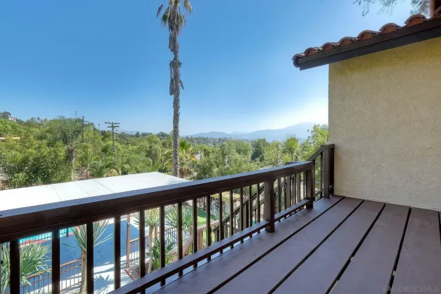 a view of a house with a tree