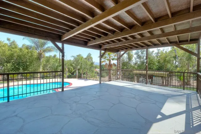 an aerial view of a house with outdoor space